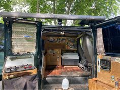 the inside of an old van with its doors open