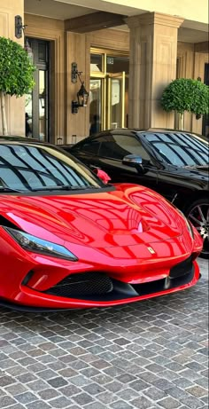 a red sports car parked in front of a building