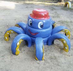 an inflatable toy octopus with a red hat on it's head and eyes