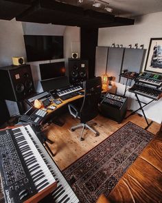 a recording studio with many electronic equipment