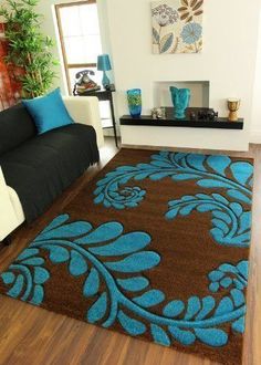 a living room filled with furniture and a blue rug