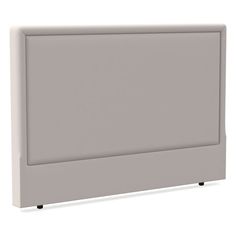 a white headboard with black legs and a light gray cover