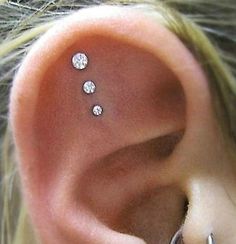 an ear with three small white diamonds on it