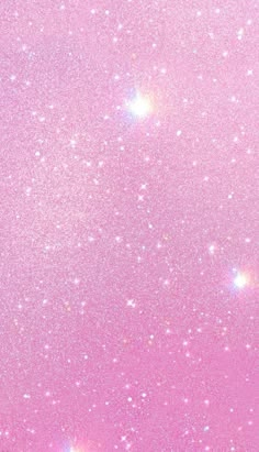 the sky is filled with stars and pink hues