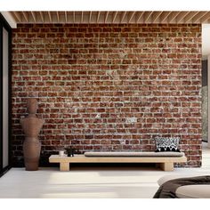 a living room with brick walls and furniture