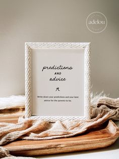 a white frame with the words predicciona and advice on it next to some blankets