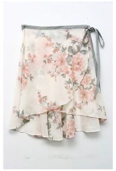 a white skirt with pink flowers on it