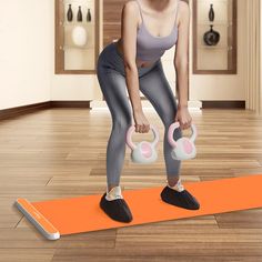 a woman is doing exercises on an exercise mat