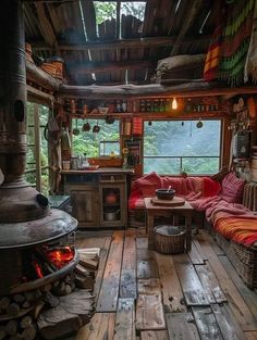 a living room filled with furniture and a fire place in the middle of it's walls