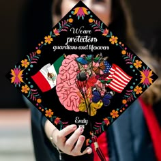 a woman holding a graduation cap with an image of a brain