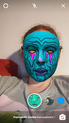 a woman with her face painted in blue and pink