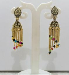 This Unique pair of Earrings is designed and crafted at PraNiCollectioNs  PraNiCollectioNs is the place for anyone who Is in lookout for a latest trend with an ethnic touch.  We at PraNiCollectioNs offers a great range of Indian Ethnic jewellery's. We are strongly committed to  providing our customers  some uniquely handcrafted products with utmost satisfaction. These jewellery's are made from high quality  material which are Hypoallergenic and are also free from corrosion and rusting This listi Festive Metal Temple Jewelry Earrings, Multicolor Metal Chandbali Earrings, Traditional Metal Earrings For Festive Occasions, Temple Jewelry Style Metal Chandelier Earrings, Multicolor Temple Jewelry Earrings For Festival, Multicolor Oxidized Temple Jewelry Earrings, Metal Temple Jewelry Chandelier Earrings, Traditional Festive Metal Earrings, Temple Jewelry Metal Earrings With Tilla