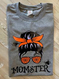 Tees for Moms!  Halloween is around the corner and moms also can wear something cool 😎. Hanes T-shirts - applied HTV graphics. Also the vinyl colors used are Black, lilac and orange.  Please select the correct size as this graphic tees are not refundable. If you have any questions, please send me a message. I would be glad to help you. Halloween Shirt Ideas For Women, Iron On Vinyl Cricut T Shirts Ideas, Halloween Shirts For Women, Halloween T Shirts, Halloween T-shirt, Halloween T Shirt, Halloween Shirts Vinyl, Halloween T Shirt Ideas, Halloween Tshirt Ideas