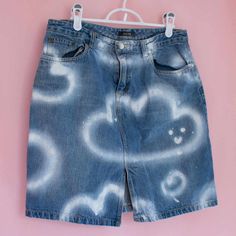 Denim skirt upcycled with textile spray paint. Cute smiling clouds design. Part of my very first collection of upcycled clothing presented at the 2023 M.A.D. festival.  Medium size for women Spray Painted Jeans, Spray Paint Clothes, Spray Paint Jeans, Painted Denim Skirt, Jeans Painting, Painted Skirt, Jeans Art, Waves Art, Upcycled Clothes