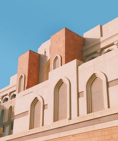 the building has many windows and arches on it