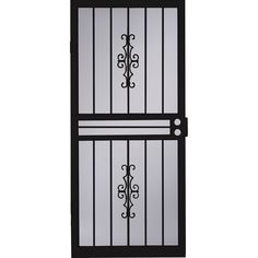 an iron door with glass panels and wrought bars on the top, against a white background