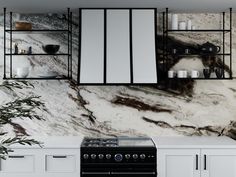 a black stove top oven sitting in a kitchen next to white cabinets and counter tops