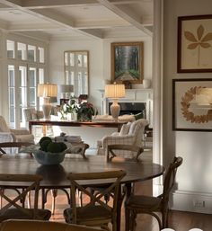 a living room filled with furniture and lots of windows