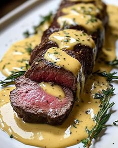 steak with mustard sauce on a white plate