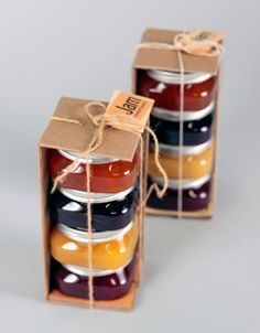 two boxes with jams in them are tied up and ready to be packaged into the package