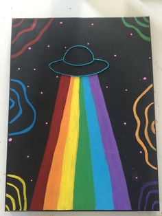 an image of a painting with a rainbow in the sky and a space ship painted on it