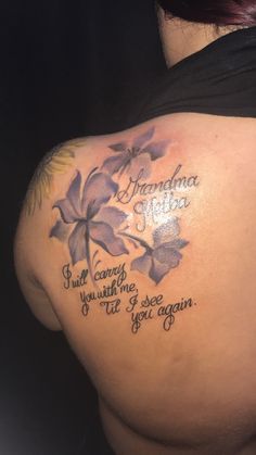 the back of a woman's shoulder with flowers on it and an inscription that says grandma