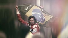 a man holding up a flag while standing in front of a group of other people