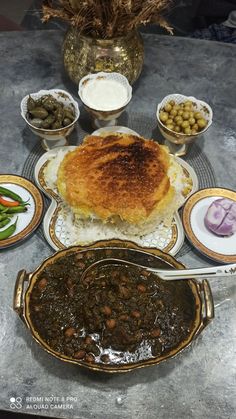 a table topped with lots of different types of food