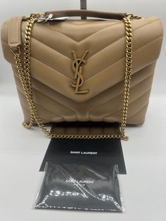 Stunning!!! YSL Yves Saint Laurent Small Lou Lou Puffer Bag in Natural Tan Leather!!! YSL Yves Saint Laurent Small size Lou Lou Puffer Bag, Shoulder Bag, Crossbody in Natural t Leather. Authentic. Timeless piece!!! Comes with original dust bag, tags, authenticity cards and a gift receipt. Also YSL gift box. Beautiful YSL handbag with gold logo on a tan leather with gold hardware. The bag measures 9” L x 7” H x 3.5” D Strap: from 12” to 22” adjustable Made in Italy! Retail: over $3200 with tax Th Ysl Handbag, Saint Laurent Purse, Ysl Handbags, Puffer Bag, Bag Closet, Bag Ysl, Tan Leather Bag, Ysl Saint Laurent, Birkenstock Boston Shearling