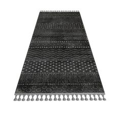 a black and white rug with tassels on the bottom, in front of a white background