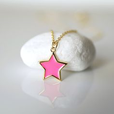 "Beautiful and lovely pink star charm necklace. Made of dainty neon pink enamel star charm with skinny gold plated brass chain. The simple and natural-looking dainty necklace is good for yourself or gift! Your necklace will ship in a rudiana gift box. ♥ Gold Plated over Brass / Neon pink enamel ♥ Chain length 14\" - 20\" ♥ Pink star charm 1/2\" ♥ Creation Time: 1 - 3 days ♥ US shipping transit time: 3-5days ♥ See more Rudiana Accessories Rudiana.etsy.com" Pretzel Necklace, Prom Necklaces, Gold Moon Necklace, Star Charm Necklace, Pink Star, Infinity Necklace, Pink Enamel, Pink Stars, Jewelry Stand