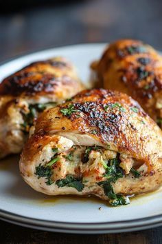 three pieces of chicken on a white plate