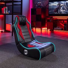 a gaming chair in the middle of a room with red and blue lights on it