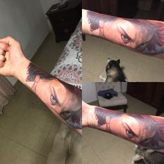 a man's arm with tattoos on it and a dog sitting in the background