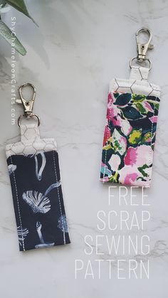 two key fobs are sitting on a marble surface with the text free scrap sewing pattern