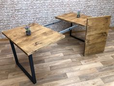 two wooden tables sitting next to each other on top of a hard wood floored floor