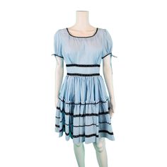 Dance around in this vintage 1960s square dance style light blue dress with a full skirt, fitted waist, cut out sleeves with ties and ric rac with silver metallic details and lace details. Dress zips up the back with a metal zipper and fabric is on the sheer side. LABEL: - FABRIC: - SHOULDERS: 15.5" BUST: 39" WAIST: 28" SHOULDER TO WAIST: 15" to seam LENGTH: 35" CONDITION: excellent PINNED TO MODEL?: no ☝For reference Mod's measurements are S 11", B 32.5", W 24", H 32.5"☝ [1-1401] ♪ We love to w Square Dance Dress, Square Dance Dresses, Dance Style, Light Blue Dress, Square Dance, Square Dancing, Light Blue Dresses, Ric Rac, Dance Fashion