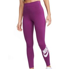 Brand New With Tags An Absolute Essential. These Women's Nike Leggings Offer A High-Rise Design And A Comfortable Stretch Waistband. Stretchy, Sweat-Wicking Fabric And A Nike Print Make These An Easy Choice For Everyday Wear. Product Features Soft And Stretchy Fabric Helps Wick Sweat Away From Your Body To Help Keep You Feeling Cool And Dry Throughout The Day Printed Graphic At The Calf Lets You Rep The Brand In Style Casual Pants With Logo Waistband, Stretch Activewear With Logo Waistband For Sports, Spring Bottoms With Logo Waistband, Nike Fitted Spring Activewear, Nike Fitted Activewear For Spring, Spring Nike Fitted Activewear, Fitted Nike Activewear For Spring, Casual Purple Sports Leggings, Nike Fitted Activewear For Jogging