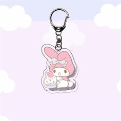 a hello kitty keychain with a pink bow on it