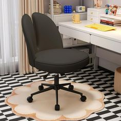 a black and white desk chair sitting on top of a checkered floor next to a window