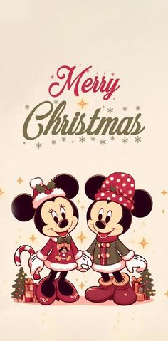 two mickey and minnie mouses standing next to each other in front of a christmas card