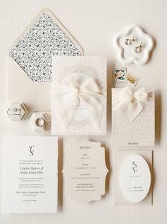 the wedding stationery is laid out neatly