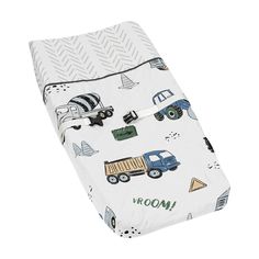 a baby crib sheet with trucks and boats printed on the front, in white