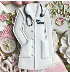 a cake shaped like a doctor's coat and stethoscope