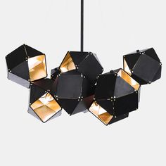 a black and gold chandelier hanging from a ceiling