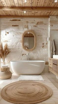 a white bath tub sitting next to a sink under a mirror on top of a wooden ceiling