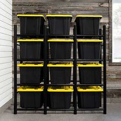 black and yellow bins are stacked on a shelf