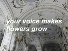 the inside of a building with flowers growing on it's ceiling and an inscription that reads, your voice makes flowers grow