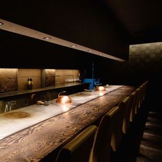 an empty bar is lit up with candles