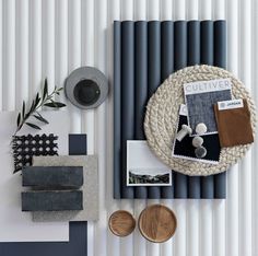 a table topped with different types of items next to a wall mounted radiator